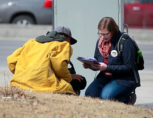 BORIS MINKEVICH / WINNIPEG FREE PRESS
A Street Census of homeless Winnipeggers was done today. This photo was taken in the park at the corner of Higgins and Main. Here volunteer Heather Campbell-Enns interviews a homeless person. April 18, 2018