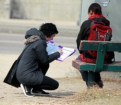 BORIS MINKEVICH / WINNIPEG FREE PRESS
A Street Census of homeless Winnipeggers was done today. This photo was taken in the park at the corner of Higgins and Main. Here volunteer Lisa Manning, left, interviews someone. April 18, 2018