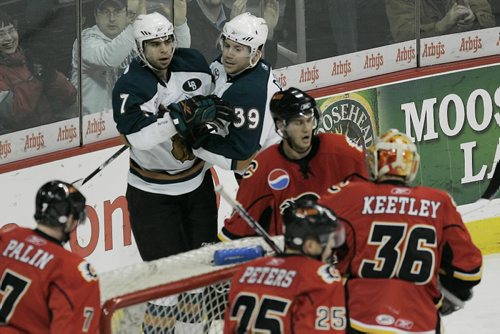 John Woods / Winnipeg Free Press / December 19/08 - 081219  - Manitoba Moose Michel Ouellet (7) celebrates his goal with Mark Derlago (39) against the Quad City Flames in first period AHL action in Winnipeg Friday, December 19, 2008.