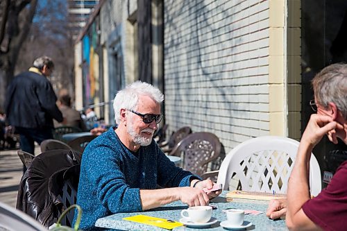MIKAELA MACKENZIE / WINNIPEG FREE PRESS
Rob Miller (left) plays crib on the patio with his friend, James McBride, on Bar Italia's patio in the warm spring weather on Corydon in Winnipeg on Thursday, April 19, 2018. A new patio smoking ban on took effect on April first.
Mikaela MacKenzie / Winnipeg Free Press 2018.