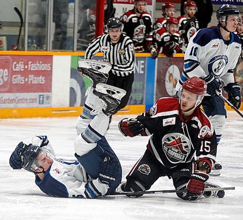 PHIL HOSSACK / WINNIPEG FREE PRESS - Steinbach Piston #5 Darby Gula and Virden Capials #15 Graeme Hore get tangled Thursday evening in Steinbach. - April 19, 2018