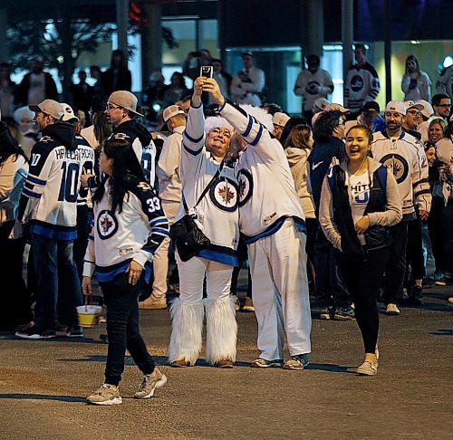 PHIL HOSSACK / WINNIPEG FREE PRESS -  Jets fans celebrate at Portage and Main Friday evening after the the Winnipeg Jets win playoff series against the Minnesota Wild. - April 20, 2018