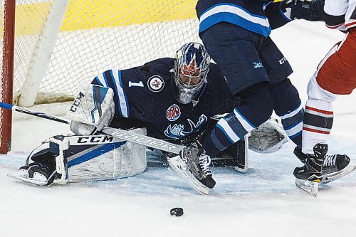MIKE DEAL / WINNIPEG FREE PRESS
Manitoba Moose goaltender Eric Comrie (1) keeps his eye the puck against the Grand Rapids Griffins during game 1 of the first round of the AHL playoffs at Bell MTS Place Saturday afternoon.
180421 - Saturday, April 21, 2018.