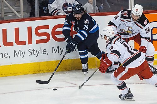MIKE DEAL / WINNIPEG FREE PRESS
Manitoba Moose Nic Petan (19) tries to keep control of the puck in the first period against the Grand Rapids Griffins during the game 1 of the first round of the AHL playoffs at Bell MTS Place Saturday afternoon.
180421 - Saturday, April 21, 2018.