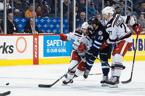 MIKE DEAL / WINNIPEG FREE PRESS
Manitoba Moose Nic Petan (19) is squeezed off the puck by Grand Rapids Griffins Luke Esposito (19) and Evgeny Svechnikov (77) during the second period of game 1 of the first round in the AHL playoffs at Bell MTS Place Saturday afternoon.
180421 - Saturday, April 21, 2018.