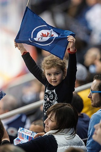 MIKE DEAL / WINNIPEG FREE PRESS
Manitoba Moose fan Violet Stewart, 5, waves a Winnipeg Jet flag during the last minutes of game 1 against the Grand Rapids Griffins in the first round in the AHL playoffs at Bell MTS Place Saturday afternoon.
180421 - Saturday, April 21, 2018.