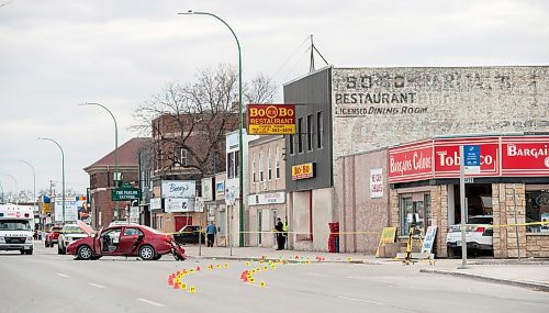 MIKE SUDOMA PHOTO
The aftermath of a traffic collision Saturday evening resulting in 3 people (2 police officers, and 1 driver of the other car) taken to hospital and police cruiser crashing into a local convenience store, Bargains Galore, on the intersection of Polson and Main St., Winnipeg MB. April 21, 2018.