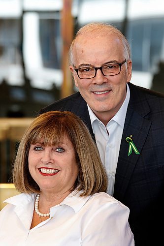 PHIL HOSSACK / WINNIPEG FREE PRESS - Scott Oake and his wife Anne pose at City Hall Monday. The Oakes received a $9000.00 cheque from the Winnipeg CofC as the proceeds from their State of the City Address, and another $3000.00 top up from Ambert El Tassi towards the Bruce Oake Memorial Foundation. Aldo Santin story. - April 23, 2018