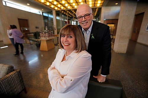 PHIL HOSSACK / WINNIPEG FREE PRESS - Scott Oake and his wife Anne pose at City Hall Monday. The Oakes received a $9000.00 cheque from the Winnipeg CofC as the proceeds from their State of the City Address, and another $3000.00 top up from Ambert El Tassi towards the Bruce Oake Memorial Foundation. Aldo Santin story. - April 23, 2018
