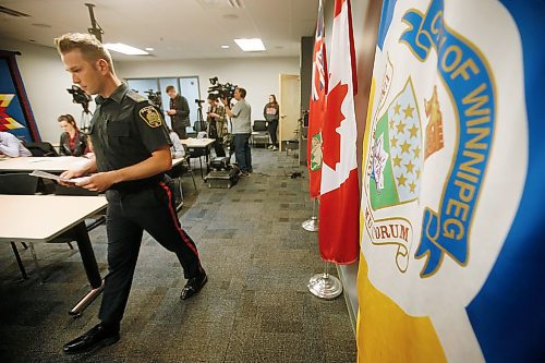 Winnipeg Police Service (WPS) Constable Jay Murray addresses media regarding reports of a emergency message being played over a loud speaker in the Osborne area in Winnipeg, Monday, April 23, 2018.  THE CANADIAN PRESS/John Woods
