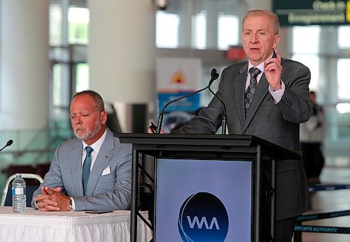 BORIS MINKEVICH / WINNIPEG FREE PRESS
Winnipeg Airports Authority (WAA) Annual Public Meeting held at the Winnipeg Richardson International Airport Departures Level, 1970 Wellington Avenue. WAA President and CEO Barry Rempel, right, talks to the people attending. Left sitting is Tom Payne Jr., WAA Board of Directors Chair. MARTIN CASH STORY. April 25, 2018