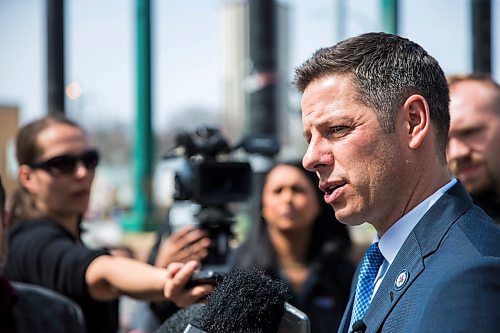 MIKAELA MACKENZIE / WINNIPEG FREE PRESS
Mayor Bowman scrums with the media on various topics after announcing funding to support a new foot patrol ambassador program for the Osborne Village neighbourhood in Winnipeg on Wednesday, April 25, 2018. 
Mikaela MacKenzie / Winnipeg Free Press 2018.