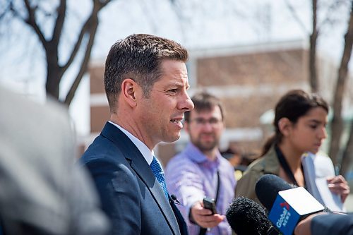 MIKAELA MACKENZIE / WINNIPEG FREE PRESS
Mayor Bowman scrums with the media on various topics after announcing funding to support a new foot patrol ambassador program for the Osborne Village neighbourhood in Winnipeg on Wednesday, April 25, 2018. 
Mikaela MacKenzie / Winnipeg Free Press 2018.