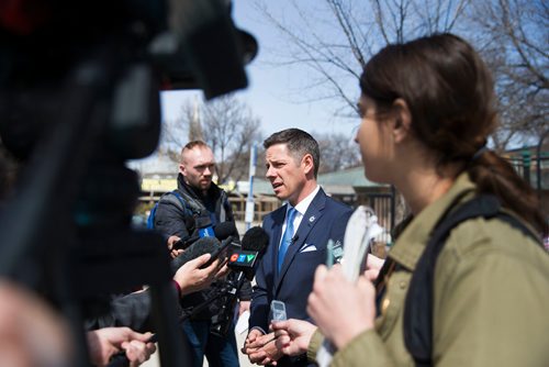 MIKAELA MACKENZIE / WINNIPEG FREE PRESS
Mayor Bowman scrums with the media on various topics after announcing funding to support a new foot patrol ambassador program for the Osborne Village neighbourhood in Winnipeg on Wednesday, April 25, 2018. 
Mikaela MacKenzie / Winnipeg Free Press 2018.