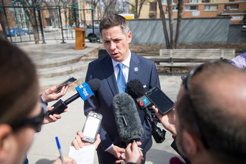 MIKAELA MACKENZIE / WINNIPEG FREE PRESS
Mayor Bowman scrums with the media on various topics after announcing funding to support a new foot patrol ambassador program for the Osborne Village neighbourhood in Winnipeg on Wednesday, April 25, 2018. 
Mikaela MacKenzie / Winnipeg Free Press 2018.