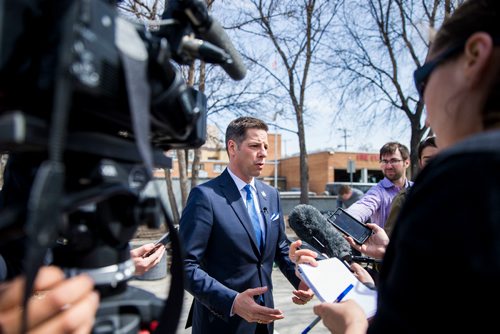 MIKAELA MACKENZIE / WINNIPEG FREE PRESS
Mayor Bowman scrums with the media on various topics after announcing funding to support a new foot patrol ambassador program for the Osborne Village neighbourhood in Winnipeg on Wednesday, April 25, 2018. 
Mikaela MacKenzie / Winnipeg Free Press 2018.