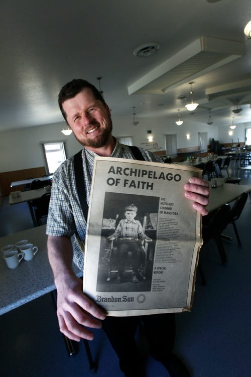 PHIL HOSSACK/Winnipeg Free Press - Edward Hofer shows off a front page of a Brandon Sun Special Edition on the Hutterite Faith at the James Vally Hutterite Colony West of Winnipeg Tuesday. random Sun photo and this one.) One of the original Hutterite settlements in Manitoba the James Valley community celebrates it's 100th Anniversary this year.  -  April 24, 2018