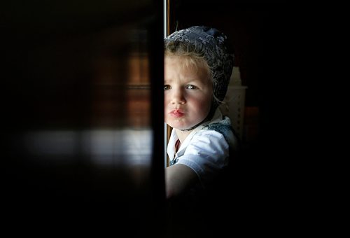 PHIL HOSSACK/Winnipeg Free Press - A young community member peers back at the camera at James Valley Hutterite Colony Tuesday  One of the original Hutterite settlements in Manitoba the James Valley community celebrates it's 100th Anniversary this year.  -  April 24, 2018