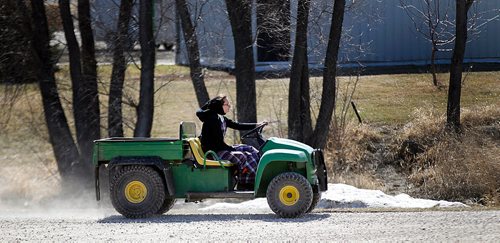 PHIL HOSSACK/Winnipeg Free Press - A community member moves around the colony on a "quad" at James Valley Hutterite Colony Tuesday  One of the original Hutterite settlements in Manitoba the James Valley community celebrates it's 100th Anniversary this year.  -  April 24, 2018