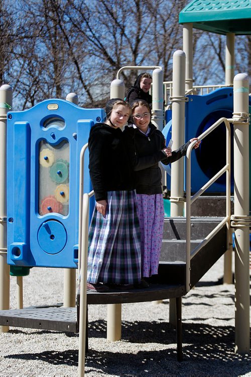 PHIL HOSSACK/Winnipeg Free Press - A pair of students pose at recess at James Valley Hutterite Colony Tuesday  One of the original Hutterite settlements in Manitoba the James Valley community celebrates it's 100th Anniversary this year.  -  April 24, 2018