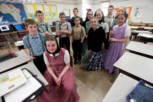 PHIL HOSSACK/Winnipeg Free Press -Students in the James Vally Colony School, (Grades 5-8) pose in their classroom at the James Valley Hutterite Colony, one of the original settlements in Manitoba the community celebrates it's 100th Anniversary this year. Bill Redekop story. April 24, 2018