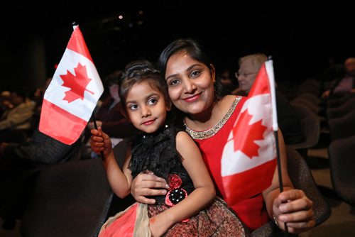 RUTH BONNEVILLE / WINNIPEG FREE PRESS

Devanshi Nikulkumar Patel (5yrs) and her mom Rinkuben Mahendrabhai Patel wave the Canadian Flag after receiving their Canadian citizenship along with others at  a formal ceremony held at the WAG on Wednesday.  

April 24,  2018
