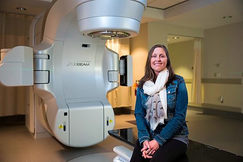 MIKAELA MACKENZIE / WINNIPEG FREE PRESS
Jennifer Dornbush, who is going through her second round with cancer, sits in front of the new linear accelerator after a treatment at the CancerCare clinic in Winnipeg on Wednesday, April 25, 2018. 
Mikaela MacKenzie / Winnipeg Free Press 2018.