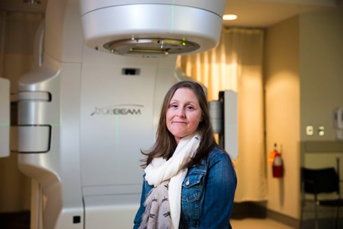 MIKAELA MACKENZIE / WINNIPEG FREE PRESS
Jennifer Dornbush, who is going through her second round with cancer, sits in front of the new linear accelerator after a treatment at the CancerCare clinic in Winnipeg on Wednesday, April 25, 2018. 
Mikaela MacKenzie / Winnipeg Free Press 2018.