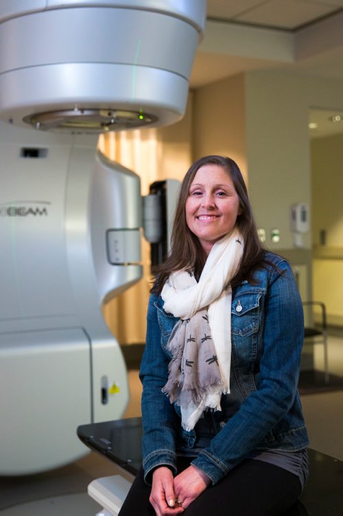 MIKAELA MACKENZIE / WINNIPEG FREE PRESS
Jennifer Dornbush, who is going through her second round with cancer, sits in front of the new linear accelerator after a treatment at the CancerCare clinic in Winnipeg on Wednesday, April 25, 2018. 
Mikaela MacKenzie / Winnipeg Free Press 2018.