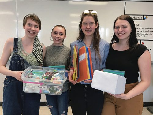 Canstar Community News (From left) Sarah Teakle, Julianna Chubenko, Katya Meehalchan and Emily Barnowich are Grade 11 students at Mennonite Brethren Collegiate Institute who recently built visitation kits for Bethania Care Home residents. The kits are designed to help improve cognitive memory among residents with Alzheimer's and dimentia. (SHELDON BIRNIE/CANSTAR/THE HERALD)