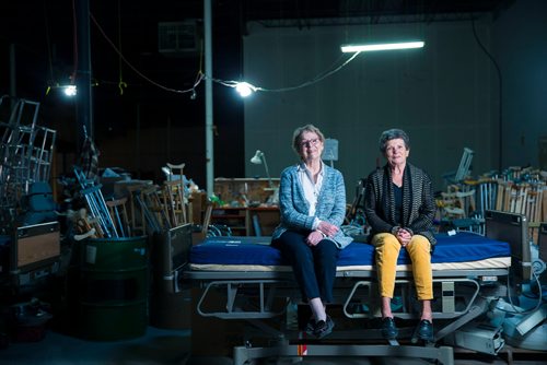MIKAELA MACKENZIE / WINNIPEG FREE PRESS
Roma Maconachie (left) and Valerie McIntyre, longtime volunteers with International Hope, a nonprofit that provides medical supplies to impoverished countries, pose in the warehouse in Winnipeg on Thursday, April 26, 2018. 
Mikaela MacKenzie / Winnipeg Free Press 2018.