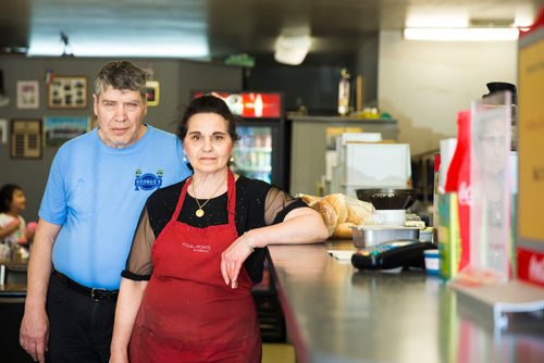 MIKAELA MACKENZIE / WINNIPEG FREE PRESS
Doros and Gina Metaxes, owners of George's Burgers & Subs, pose in the shop in Winnipeg on Thursday, April 26, 2018. They were given a mere month's notice after being in the location for 24 years.
Mikaela MacKenzie / Winnipeg Free Press 2018.