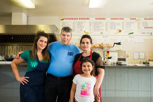 MIKAELA MACKENZIE / WINNIPEG FREE PRESS
Athena Dandrea (left), Doros Metaxes, Gina Metaxes, and Mikayla Dandrea, owners and family of George's Burgers & Subs, pose in the shop in Winnipeg on Thursday, April 26, 2018. They were given a mere month's notice after being in the location for 24 years.
Mikaela MacKenzie / Winnipeg Free Press 2018.