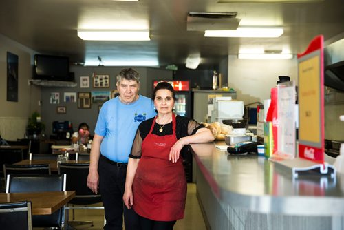 MIKAELA MACKENZIE / WINNIPEG FREE PRESS
Doros and Gina Metaxes, owners of George's Burgers & Subs, pose in the shop in Winnipeg on Thursday, April 26, 2018. They were given a mere month's notice after being in the location for 24 years.
Mikaela MacKenzie / Winnipeg Free Press 2018.