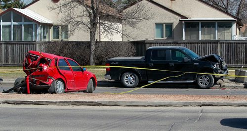 BORIS MINKEVICH / WINNIPEG FREE PRESS
MVC on Roblin Blvd. and Dale Blvd. A damaged red sedan and black truck remain at the scene. April 29, 2018