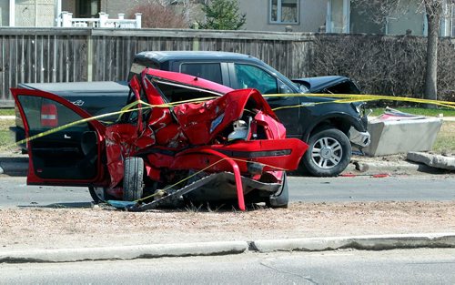BORIS MINKEVICH / WINNIPEG FREE PRESS
MVC on Roblin Blvd. and Dale Blvd. A damaged red sedan and black truck remain at the scene. Police said they arrived at the corner of Roblin Boulevard and Dale Boulevard at 8:45 a.m.  April 29, 2018