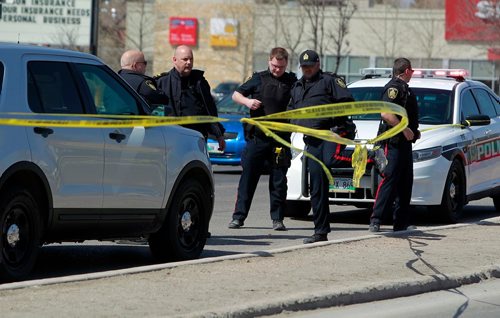 BORIS MINKEVICH / WINNIPEG FREE PRESS
MVC on Roblin Blvd. and Dale Blvd between a red sedan and black truck(not seen in photo) Police gather nearby and remain at the scene.  Police said they arrived at the corner of Roblin Boulevard and Dale Boulevard at 8:45 a.m.  April 29, 2018