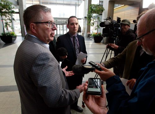 BORIS MINKEVICH / WINNIPEG FREE PRESS
Manitoba Hydro President and CEO Kelvin Shepherd, left, in media scrum in the atrium of Manitoba Hydro Place downtown(Hydro HQ). LARRY KUSCH STORY  May 1, 2018