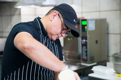 MIKAELA MACKENZIE / WINNIPEG FREE PRESS
Owner and "antojitos expert" Carlos Bosque makes flautas at the Sargent Taco Shop in Winnipeg on Tuesday, May 1, 2018. The shop makes authentic Mexican takeout food.
Mikaela MacKenzie / Winnipeg Free Press 2018.