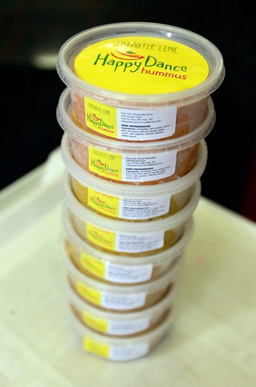 BORIS MINKEVICH / WINNIPEG FREE PRESS
INTERSECTION - Mary MacLean runs a business called Happy Dance Hummus. Here is a photo if a stack of containers she sells. May 13 is International Hummus Day. MacLean is a school teacher who launched her own hummus business three years ago. Photo taken at 851 Panet Road where her commercial kitchen is located. DAVE SANDERSON STORY May 1, 2018