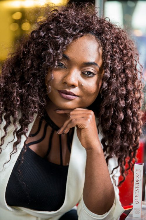 MIKAELA MACKENZIE / WINNIPEG FREE PRESS
Francine Bahati founder of Queenfidence, a new cosmetic line, poses at Ambience Hair Salon (where her products are sold) in Winnipeg on Tuesday, May 1, 2018. Francine fled the Congo at age 10 and spent years in Uganda, living in a one-room apartment with her large family, where she made her own makeup with palm oil and whatever else she could find. Her family came to Winnipeg four years ago and in December 2017 she launched Queenfidence. 
Mikaela MacKenzie / Winnipeg Free Press 2018.