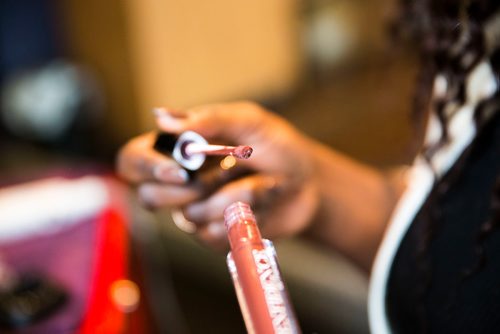 MIKAELA MACKENZIE / WINNIPEG FREE PRESS
Francine Bahati founder of Queenfidence, a new cosmetic line, poses at Ambience Hair Salon (where her products are sold) in Winnipeg on Tuesday, May 1, 2018. Francine fled the Congo at age 10 and spent years in Uganda, living in a one-room apartment with her large family, where she made her own makeup with palm oil and whatever else she could find. Her family came to Winnipeg four years ago and in December 2017 she launched Queenfidence. 
Mikaela MacKenzie / Winnipeg Free Press 2018.