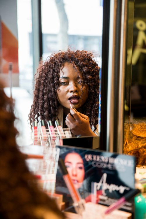 MIKAELA MACKENZIE / WINNIPEG FREE PRESS
Francine Bahati founder of Queenfidence, a new cosmetic line, poses at Ambience Hair Salon (where her products are sold) in Winnipeg on Tuesday, May 1, 2018. Francine fled the Congo at age 10 and spent years in Uganda, living in a one-room apartment with her large family, where she made her own makeup with palm oil and whatever else she could find. Her family came to Winnipeg four years ago and in December 2017 she launched Queenfidence. 
Mikaela MacKenzie / Winnipeg Free Press 2018.