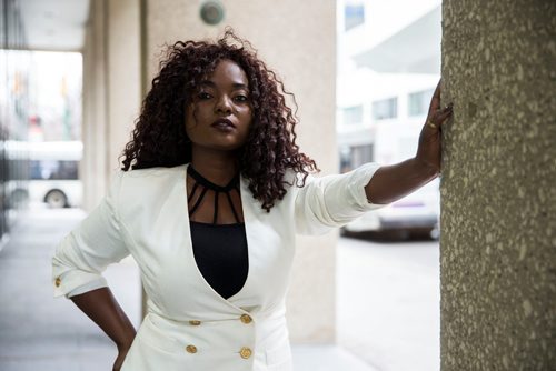 MIKAELA MACKENZIE / WINNIPEG FREE PRESS
Francine Bahati founder of Queenfidence, a new cosmetic line, poses on Carlton Street in Winnipeg on Tuesday, May 1, 2018. Francine fled the Congo at age 10 and spent years in Uganda, living in a one-room apartment with her large family, where she made her own makeup with palm oil and whatever else she could find. Her family came to Winnipeg four years ago and in December 2017 she launched Queenfidence. 
Mikaela MacKenzie / Winnipeg Free Press 2018.