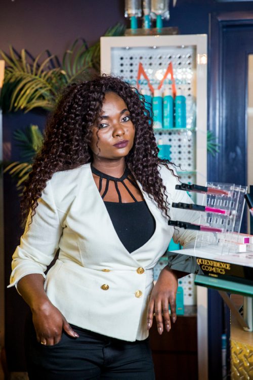 MIKAELA MACKENZIE / WINNIPEG FREE PRESS
Francine Bahati founder of Queenfidence, a new cosmetic line, poses at Ambience Hair Salon (where her products are sold) in Winnipeg on Tuesday, May 1, 2018. Francine fled the Congo at age 10 and spent years in Uganda, living in a one-room apartment with her large family, where she made her own makeup with palm oil and whatever else she could find. Her family came to Winnipeg four years ago and in December 2017 she launched Queenfidence. 
Mikaela MacKenzie / Winnipeg Free Press 2018.