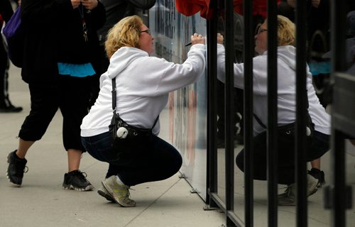 PHIL HOSSACK / WINNIPEG FREE PRESS - STREET PARTY - Fans sign a giant "I was Here" card before  the Jets Whiteout Party Tuesday.   Jessica's story.  - May 1, 2018