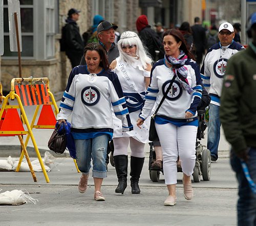 PHIL HOSSACK / WINNIPEG FREE PRESS - STREET PARTY - Fans make their way downtown for the Jets Whiteout Party Tuesday.   Jessica's story.  - May 1, 2018