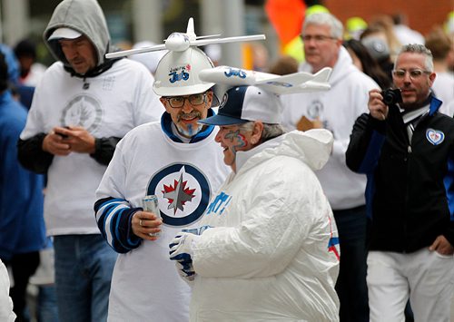 PHIL HOSSACK / WINNIPEG FREE PRESS - STREET PARTY - Deb and Paul Brissette got into the spirit underneath their Airplane hats at the Jets Whiteout Party Tuesday.   Jessica's story.  - May 1, 2018