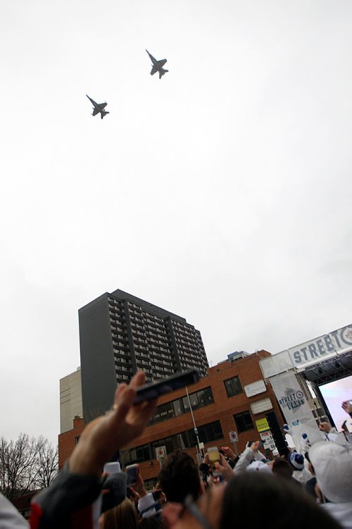 PHIL HOSSACK / WINNIPEG FREE PRESS - STREET PARTY - A pair of CF18 Hornet's buzz the crowd at the Jets Whiteout Party Tuesday.   Jessica's story.  - May 1, 2018