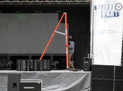 PHIL HOSSACK / WINNIPEG FREE PRESS - STREET PARTY - Stage hands assemble giant screens in the party area.  Jessica's story.  - May 1, 2018